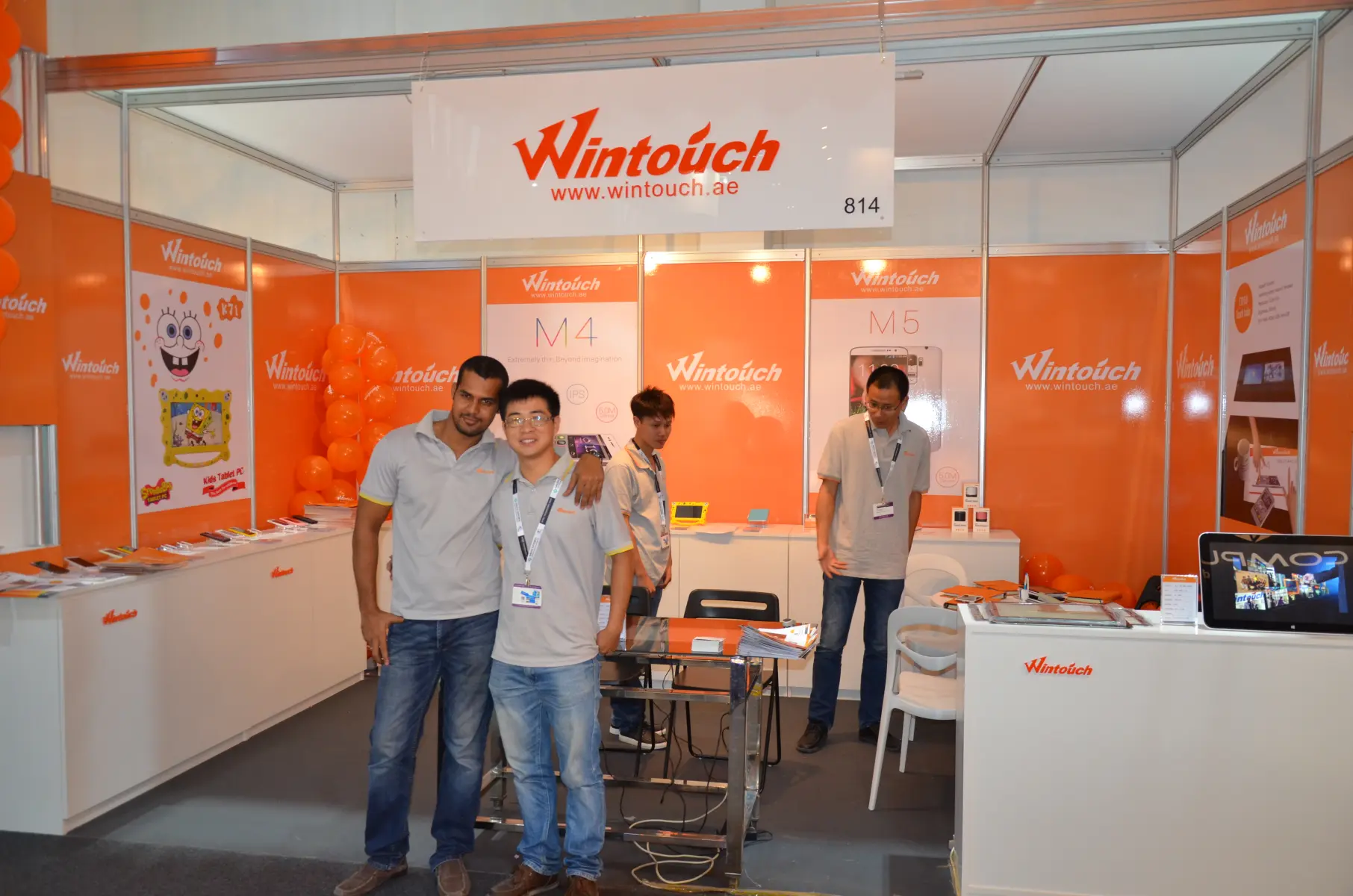 Visitors exploring Wintouch tablet products at GITEX Dubai 2014