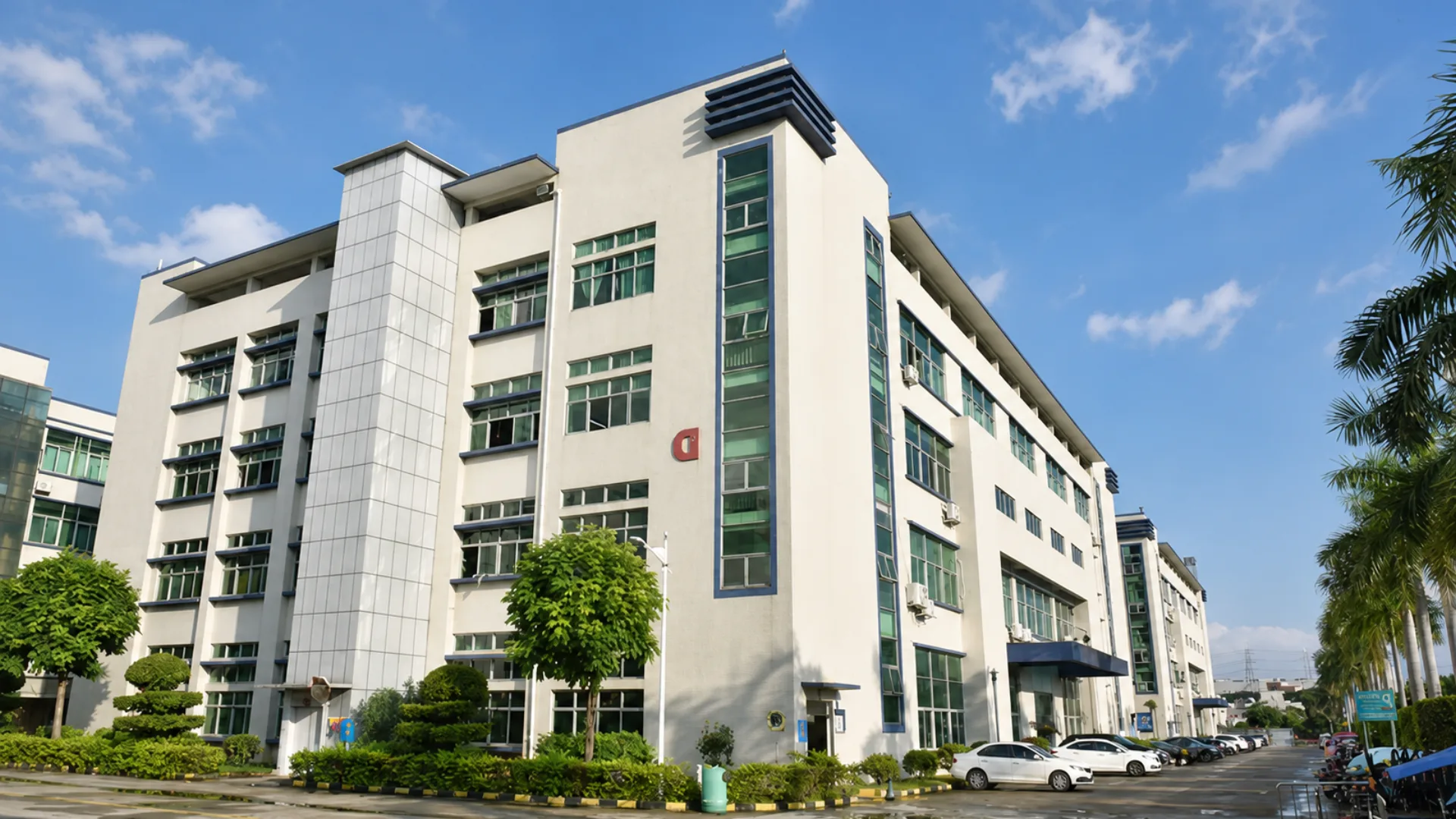 Dongguan Liontek tablet manufacturing campus under a clear blue sky
